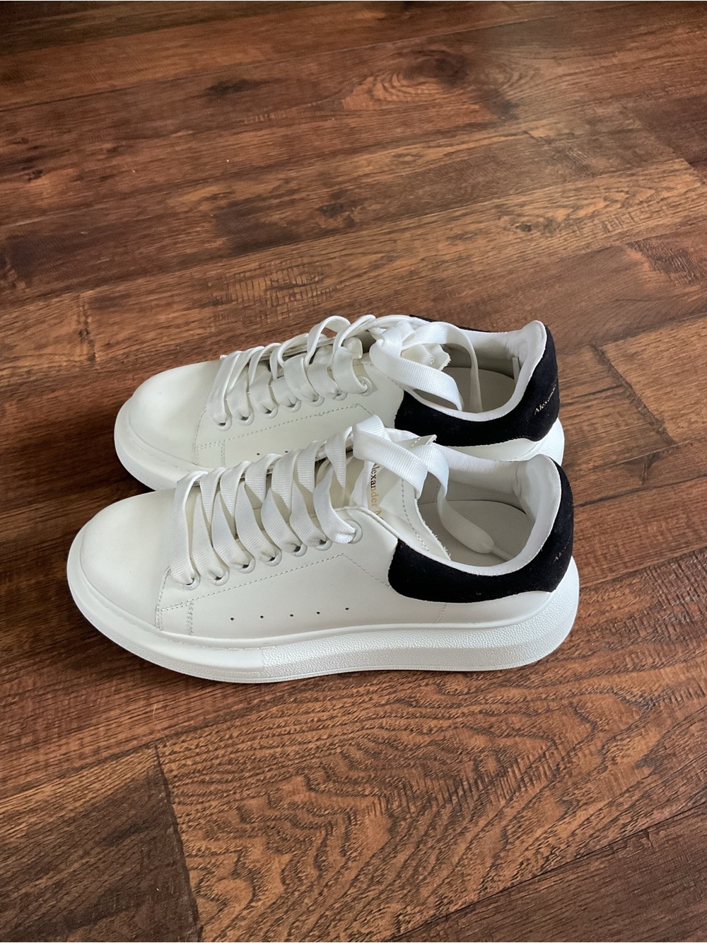 Alexander McQueen white leather oversized sneakers with black suede heel tab